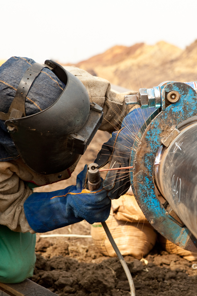 Tradesman welding on construction site