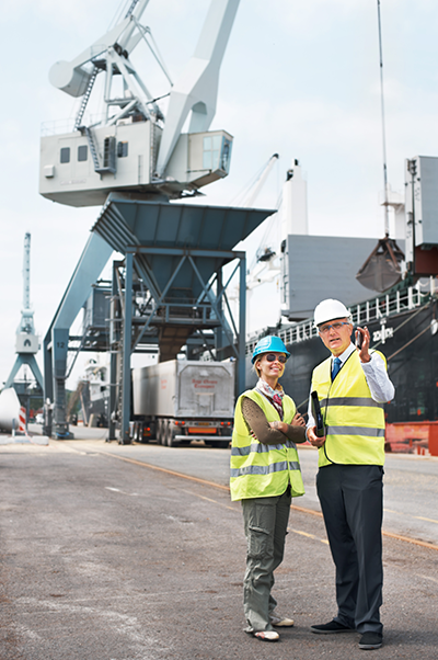 Two employees at ship yard logistics